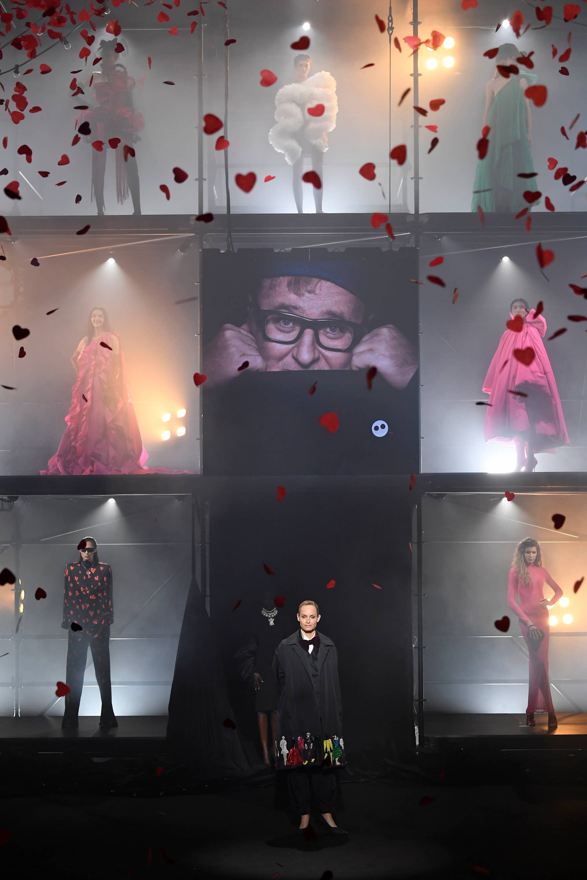 Amber Valletta poses on the runway with models during the runway during the "Love Brings Love" show